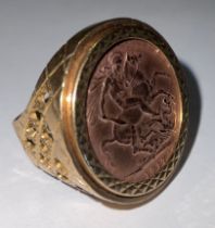 A George V gold full sovereign, 1917, mounted in 9ct gold as a signet ring, marked 375, 14g