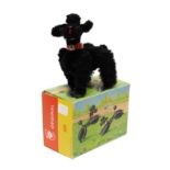Toys & Juvenalia - a West German 501 black flock covered novelty clockwork toy, in the form of a