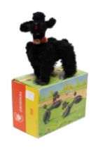 Toys & Juvenalia - a West German 501 black flock covered novelty clockwork toy, in the form of a