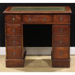 A late Victorian/Edwardian oak twin pedestal desk, of small proportions, 75.5cm high, 89.5cm wide,