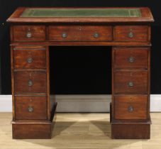 A late Victorian/Edwardian oak twin pedestal desk, of small proportions, 75.5cm high, 89.5cm wide,