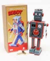 Toys & Juvenalia - a Chinese tinplate and clockwork mechanical robot, 23cm high boxed with clockwork