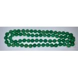 A string of Chinese jade beads, 86cm long