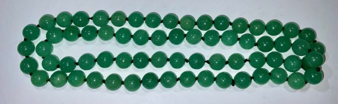 A string of Chinese jade beads, 86cm long