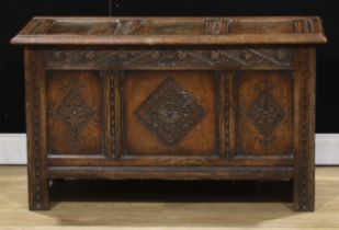 A 17th century style oak blanket chest, 61cm high, 107cm wide, 48cm deep