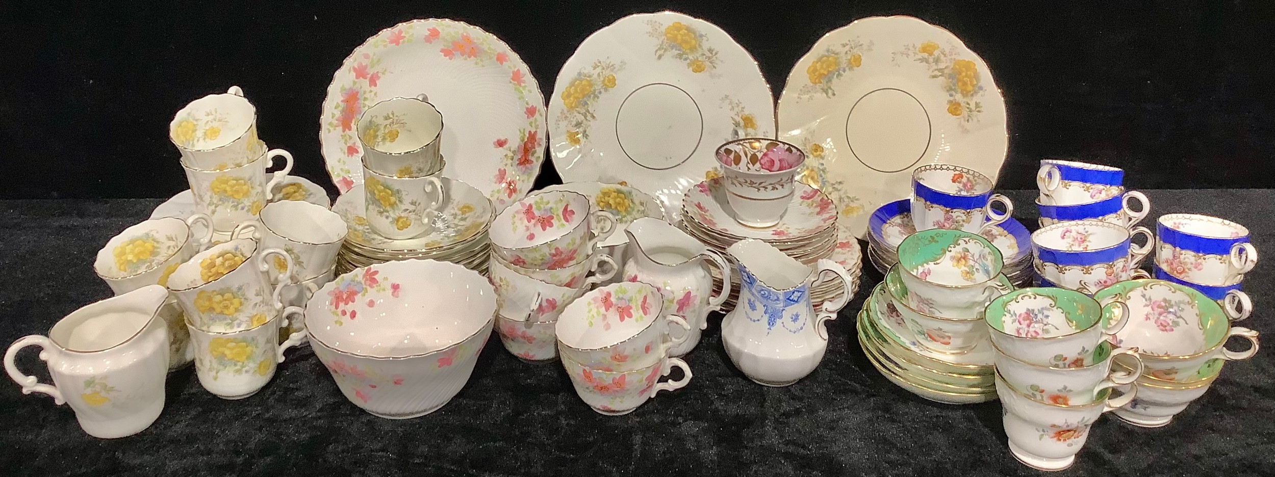 An Edwardian tea service for ten, decorated with yellow flowers, comprising cake plates, side