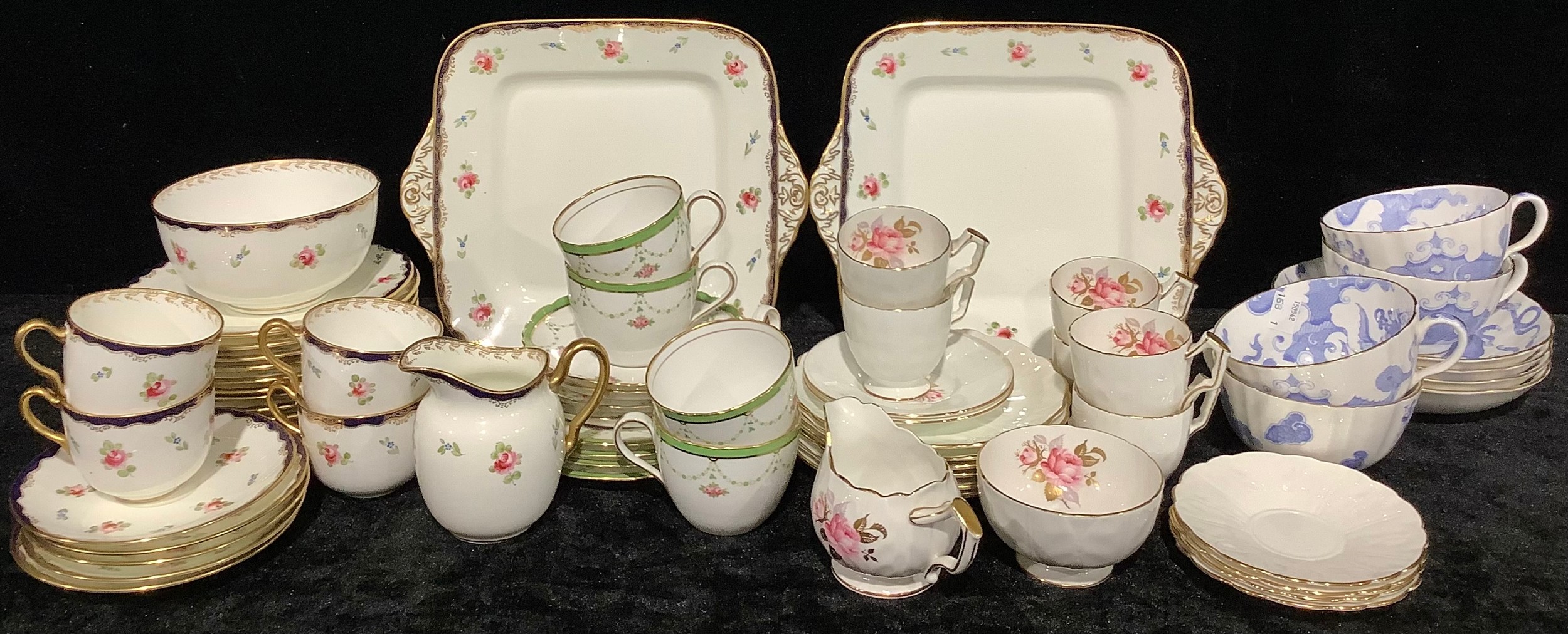 A Wedgwood part tea service, floral pattern, comprising cake plates, side plates, cream jug, sugar