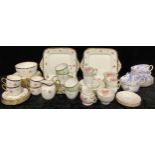 A Wedgwood part tea service, floral pattern, comprising cake plates, side plates, cream jug, sugar