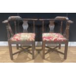 A pair of late Victorian oak corner chairs, 78.5cm high, the seat 42cm square (2)