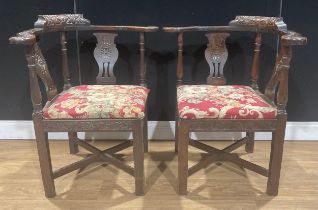 A pair of late Victorian oak corner chairs, 78.5cm high, the seat 42cm square (2)