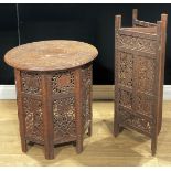 An Anglo-Indian hardwood Hoshiarpur table, 54.5cm high, 53cm diameter; a similar three-fold