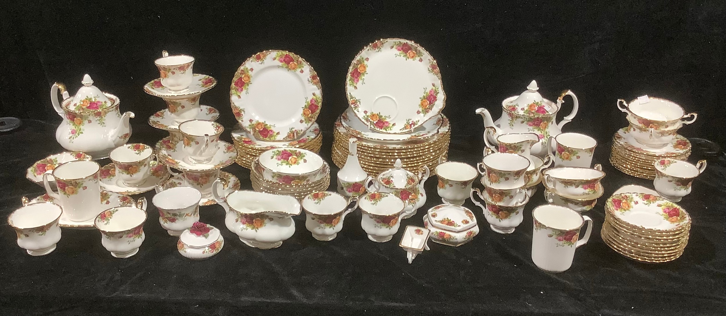 A Royal Albert Old Country Roses part dinner and tea service comprising two large teapots, twelve