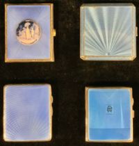 A George V/VI silver cigarette case, applied with blue engine turned enamel in sunburst motif, 8.