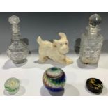 A Sylvac type model of a terrier; two cut glass decanters; a glass paperweight, signed; etc (6)
