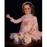 A Heubach Koppelsdorf (Germany) bisque head and ball jointed painted composition bodied doll, the