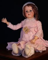 A Heubach Koppelsdorf (Germany) bisque head and ball jointed painted composition bodied doll, the