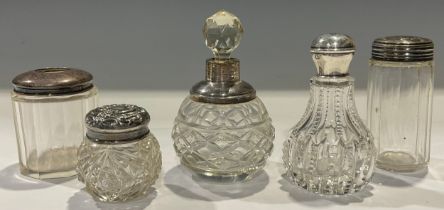 A collection of five silver topped scent bottles and jars (5)