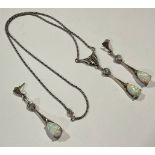 A sterling silver and marcasite suite, comprising necklace with pear cut polished opal cabochon
