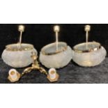 A set of three Art Deco style frosted glass ceiling lights; a brass wall light (4)