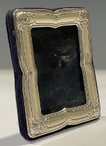 A silver easel photograph frame, 10cm high