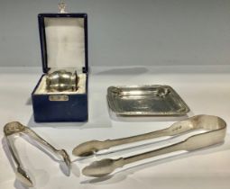 A pair of Georgian silver sugar bows, London 1817; another, Birmingham 1896; a silver trinket