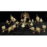 A Spanish gilt metal and porcelain five branch ceiling electrolier, encrusted in flowers in shades