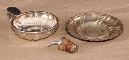 A Spanish silver spirally fluted circular dish, 10.5cm diam; a French wine taster; a silver wine