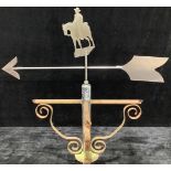 A wrought iron weather vane, steel pointer mounted with copper silhouette of a horseman, 167cm high