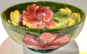 A Moorcroft Hibiscus pattern bowl, tube lined with flowers on a green ground, 20cm diameter, Queen