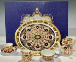 A Royal Crown Derby 1128 pattern Imari palette miniature tea service on tray, comprising, teapot,