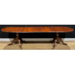 A George III style mahogany twin pedestal dining table, one additional leaf, 69.5cm high, 180.5cm