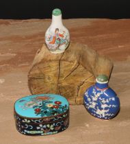 A Chinese porcelain flatenned ovoid snuff bottle, moulkded and decorated in polychrome enamels
