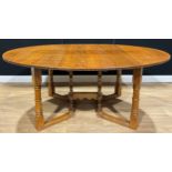 An oak double-gateleg dining table, probably Rupert/Nigel Griffiths Monastic Woodcraft, 72.5cm high,