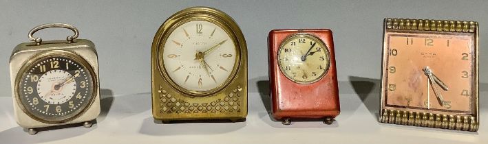 A Cyma Art Deco clock; a Europa musical alarm; an Inventic alarm; another (4)