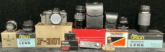 A Nikon F-301 35mm SLR camera, boxed; A Nikon Nikkor f 50mm f1.8 lens, boxed; A Sigma 28-200mm f 4-