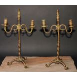 A pair of 19th century brass adjustable tripod two-light candelabra, spiral pillars, scroll feet,