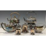 A late 19th century reeded ovoid tea kettle on stand, with burner; another tea kettle on stand,