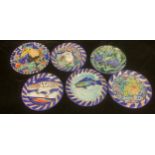 Studio Pottery - a collection of six Wetheriggs, Penrith, Pottery plates, painted with various