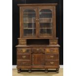An early 20th century stained pine estate office side cabinet, 216cm high, 139cm wide, 48cm deep