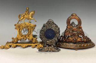 A 19th century cast iron bow front pocket watch stand, cast with a pair of sea serpents and