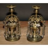 A pair of post Regency candle lustres, each campana sconce above a band of vine leaves, faceted