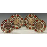 A pair of Royal Crown Derby 1128 pattern dessert plates, 21.5cm diameter, second quality; a pair