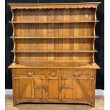 An oak dresser, probably Rupert/Nigel Griffiths Monastic Woodcraft, 192.5cm high, 170cm wide, 42cm