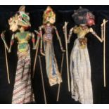 A set of three Indonesian painted Wayang Golek puppets, the largest 54cm high