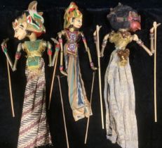 A set of three Indonesian painted Wayang Golek puppets, the largest 54cm high
