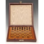 A travelling chess set, by Jaques & Son Ltd, London, the inlaid board 21cm wide, cased