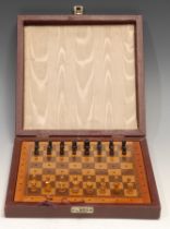 A travelling chess set, by Jaques & Son Ltd, London, the inlaid board 21cm wide, cased