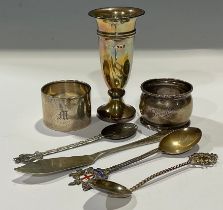 A silver pedestal specimen vase, 9.5cm high, Birmingham 1958; a silver napkin ring, Birmingham 1922;