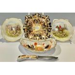 A Royal Crown Derby 2451 pattern shaped square trinket dish; a pair of hunting scene trinket dishes;