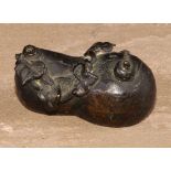 A Chinese bronze water dropper, cast as a gourd shaped fruit surmounted by a snail, 6cm long